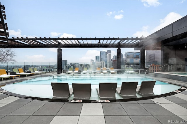 pool with a view of city and a pergola