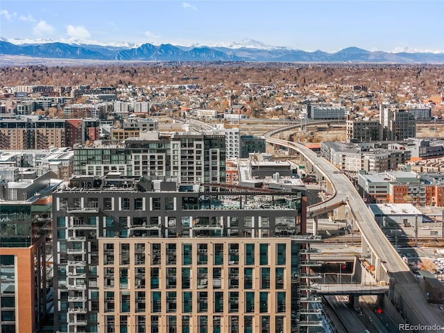 birds eye view of property with a view of city and a mountain view