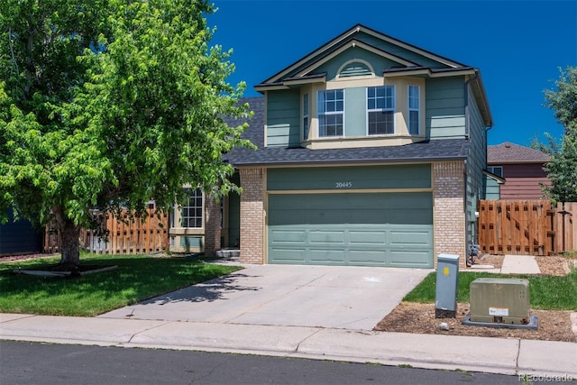 20445 Mitchell Pl, Denver, CO 80249 - traditional-style home featuring brick siding, driveway, an attached garage, and roof with shingles