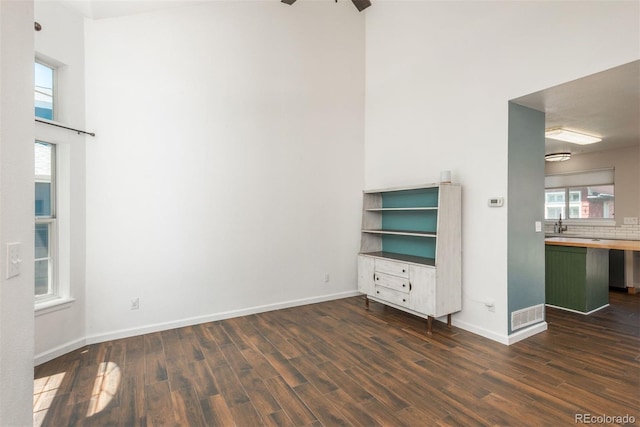 20445 Mitchell Pl, Denver, CO 80249 - unfurnished room with dark wood-style floors and healthy amount of natural light