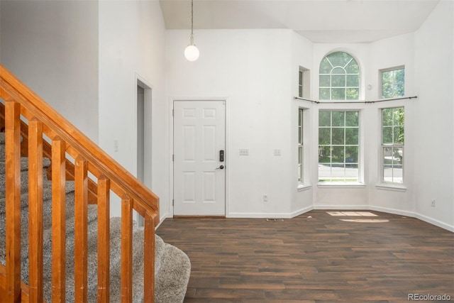 20445 Mitchell Pl, Denver, CO 80249 - entrance foyer featuring a towering ceiling, wood finished floors, and stairway