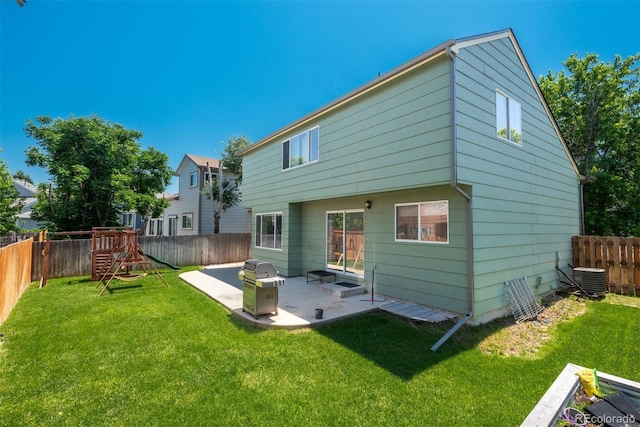 20445 Mitchell Pl, Denver, CO 80249 - rear view of property with a patio area, a fenced backyard, and a playground