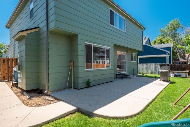 20445 Mitchell Pl, Denver, CO 80249 - rear view of property with a patio