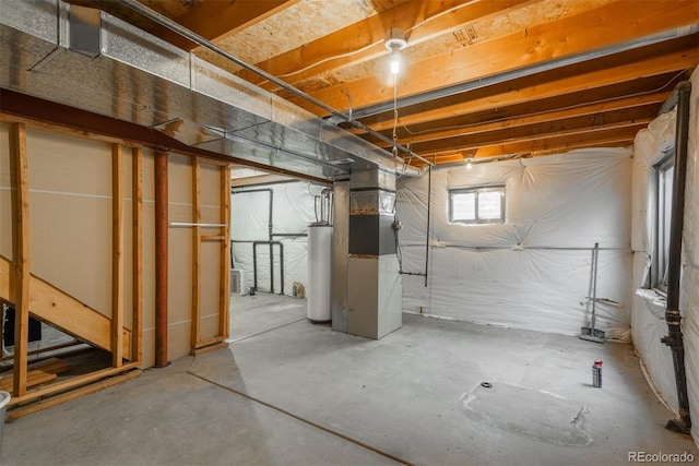 20445 Mitchell Pl, Denver, CO 80249 - basement featuring water heater and heating unit