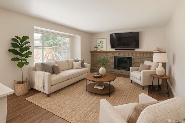 20445 Mitchell Pl, Denver, CO 80249 - living area featuring wood finished floors and a brick fireplace