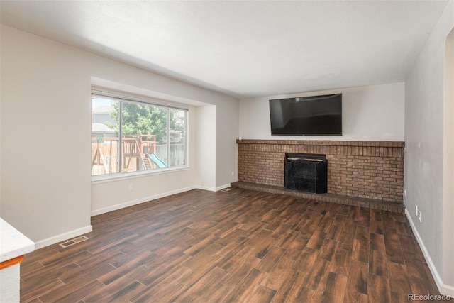 20445 Mitchell Pl, Denver, CO 80249 - unfurnished living room featuring wood finished floors and a fireplace