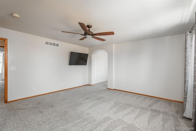 20445 Mitchell Pl, Denver, CO 80249 - carpeted empty room with arched walkways, a ceiling fan, and a smoke detector