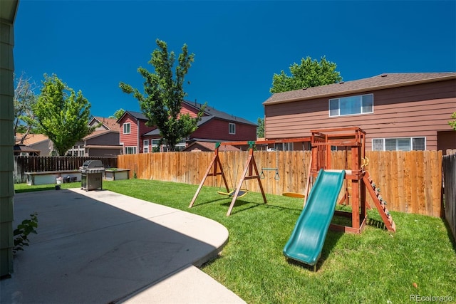 20445 Mitchell Pl, Denver, CO 80249 - view of playground with a patio area, a fenced backyard, and a residential view