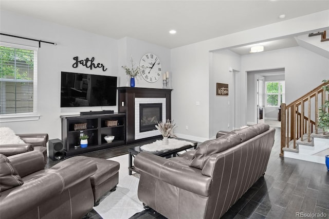 1867 W 137th Ln, Broomfield, CO 80023 - living room featuring stairway, recessed lighting, a brick fireplace, and dark wood-style floors