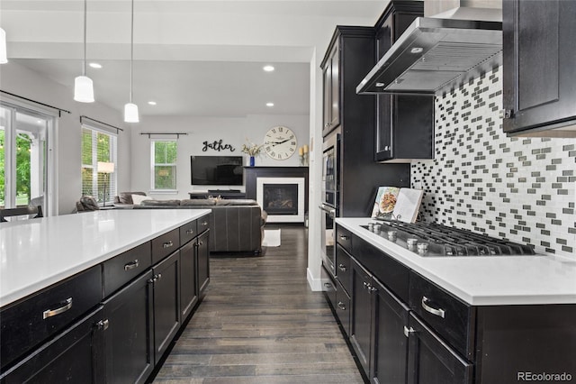 1867 W 137th Ln, Broomfield, CO 80023 - kitchen featuring wall chimney exhaust hood, appliances with stainless steel finishes, dark wood-style floors, light countertops, and recessed lighting