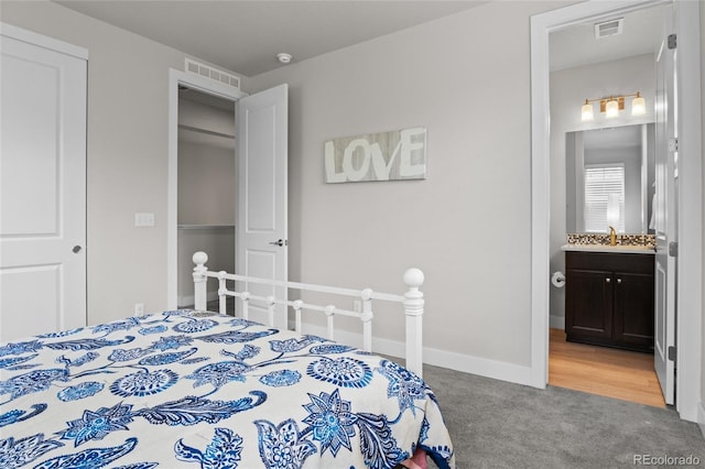 1867 W 137th Ln, Broomfield, CO 80023 - bedroom with carpet floors and connected bathroom