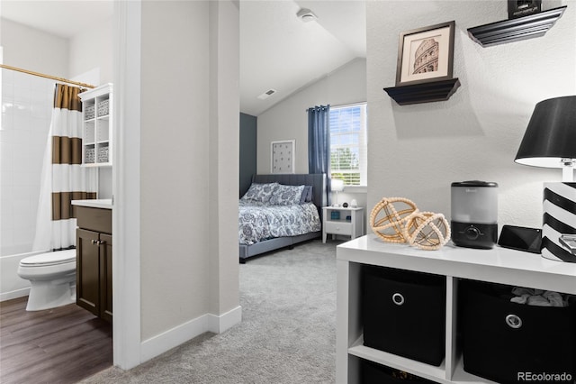 1867 W 137th Ln, Broomfield, CO 80023 - carpeted bedroom with lofted ceiling and ensuite bath