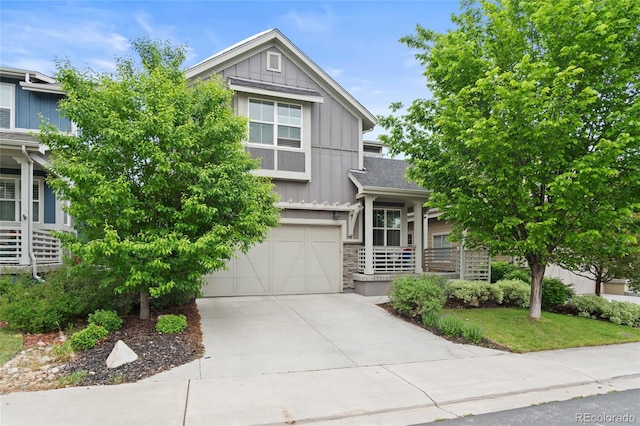 1867 W 137th Ln, Broomfield, CO 80023 - view of front of property featuring board and batten siding, an attached garage, concrete driveway, and stone siding