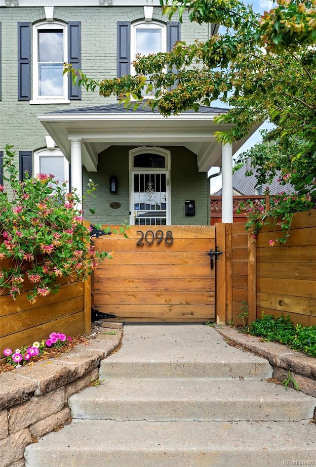 2098 N Clarkson St, Denver, CO 80205 - view of exterior entry with brick siding and covered porch