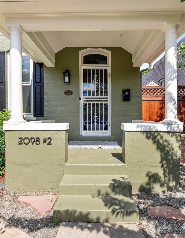 2098 N Clarkson St, Denver, CO 80205 - view of exterior entry featuring covered porch