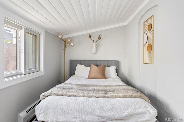 2098 N Clarkson St, Denver, CO 80205 - bedroom featuring crown molding and baseboard heating