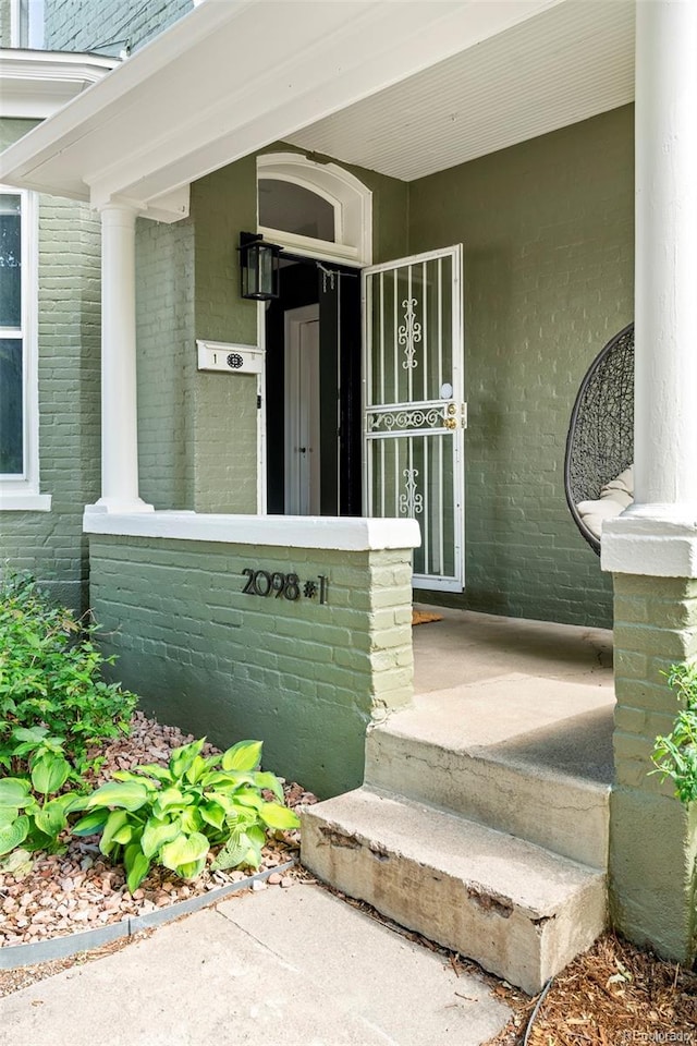 2098 N Clarkson St, Denver, CO 80205 - entrance to property featuring a porch and brick siding