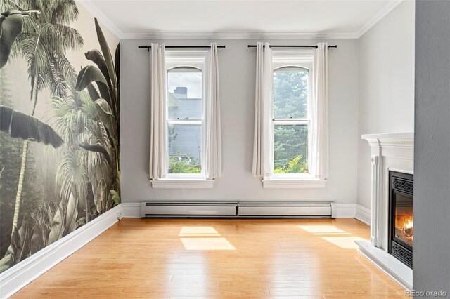2098 N Clarkson St, Denver, CO 80205 - unfurnished living room with a glass covered fireplace, ornamental molding, wood finished floors, a baseboard radiator, and baseboards