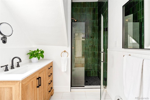 2098 N Clarkson St, Denver, CO 80205 - full bath featuring a shower stall, vanity, a wainscoted wall, and tile patterned flooring