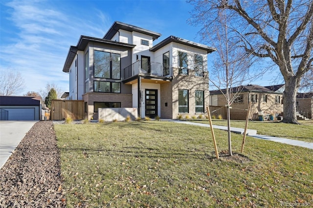 contemporary home featuring a front yard and a balcony