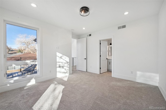 empty room featuring light colored carpet