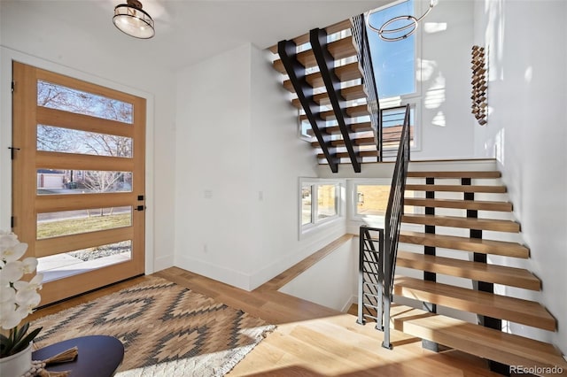 entrance foyer featuring plenty of natural light and light hardwood / wood-style flooring