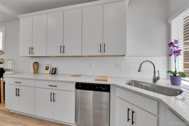 1086 Highlands Dr, Erie, CO 80516 - kitchen featuring dishwasher, a sink, and light countertops