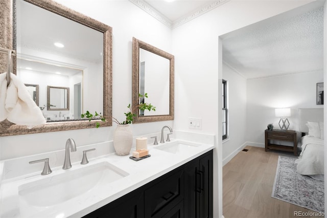 7308 S Steele Cir, Centennial, CO 80122 - bathroom with wood finished floors, double vanity, and ensuite bath