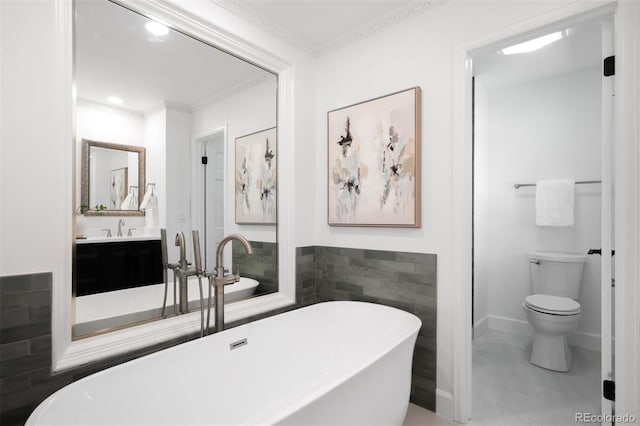 7308 S Steele Cir, Centennial, CO 80122 - bathroom featuring a freestanding tub, vanity, crown molding, recessed lighting, and tile walls