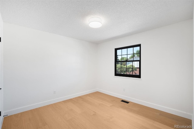 7308 S Steele Cir, Centennial, CO 80122 - unfurnished room with light wood finished floors and a textured ceiling