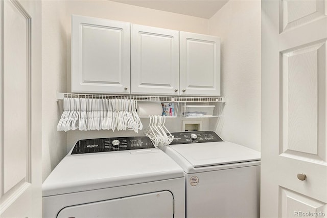 7440 S Blackhawk St Unit 2-106, Englewood, CO 80112 - laundry area with cabinet space and separate washer and dryer