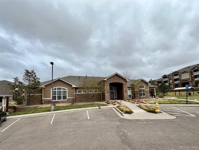 7440 S Blackhawk St Unit 2-106, Englewood, CO 80112 - view of building exterior with uncovered parking