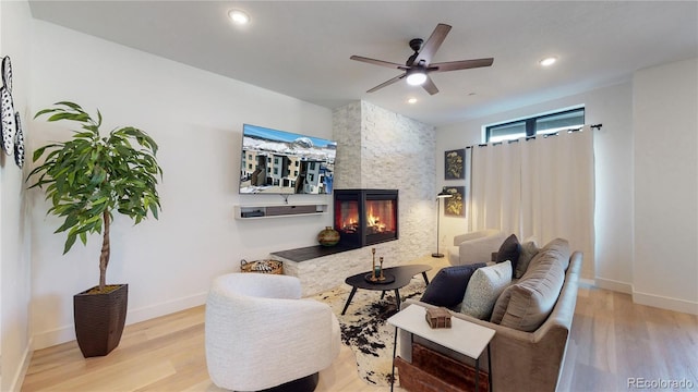 930 Blue River Pkwy Unit 622, Silverthorne, CO 80498 - living area with wood finished floors, a ceiling fan, baseboards, and recessed lighting