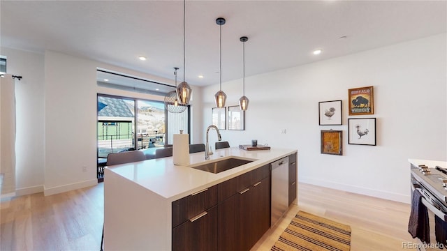 930 Blue River Pkwy Unit 622, Silverthorne, CO 80498 - kitchen featuring a sink, light wood-style flooring, modern cabinets, stainless steel appliances, and recessed lighting