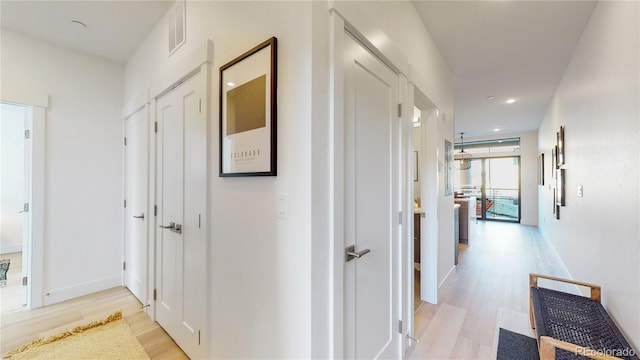 930 Blue River Pkwy Unit 622, Silverthorne, CO 80498 - hallway with light wood finished floors, recessed lighting, and baseboards