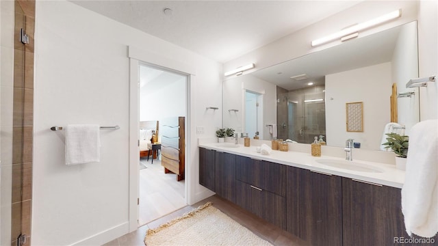 930 Blue River Pkwy Unit 622, Silverthorne, CO 80498 - full bathroom featuring ensuite bathroom, a shower stall, double vanity, and wood finished floors