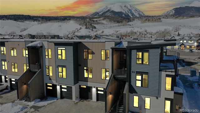 930 Blue River Pkwy Unit 622, Silverthorne, CO 80498 - view of front of house featuring a mountain view, a garage, and asphalt driveway