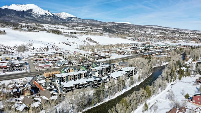 930 Blue River Pkwy Unit 622, Silverthorne, CO 80498 - snowy aerial view with a mountain view and a residential view
