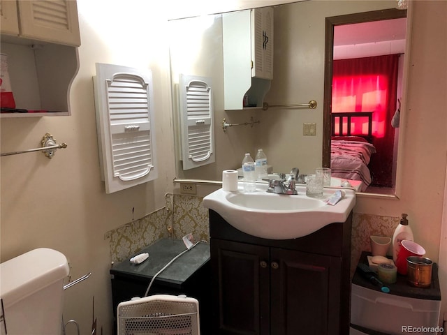 9260 County Road 133, Simla, CO 80835 - half bathroom with radiator heating unit, vanity, and toilet