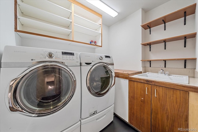 laundry area with sink and washer and clothes dryer