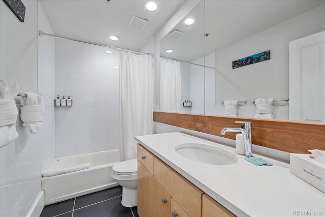 full bathroom featuring tile patterned flooring, vanity, shower / bath combination with curtain, and toilet