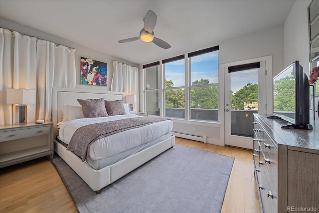 bedroom with a baseboard heating unit, access to outside, ceiling fan, and light hardwood / wood-style floors