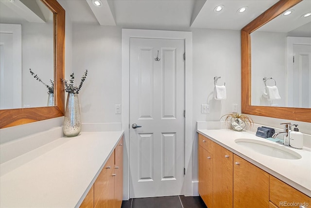 bathroom with tile patterned flooring and vanity