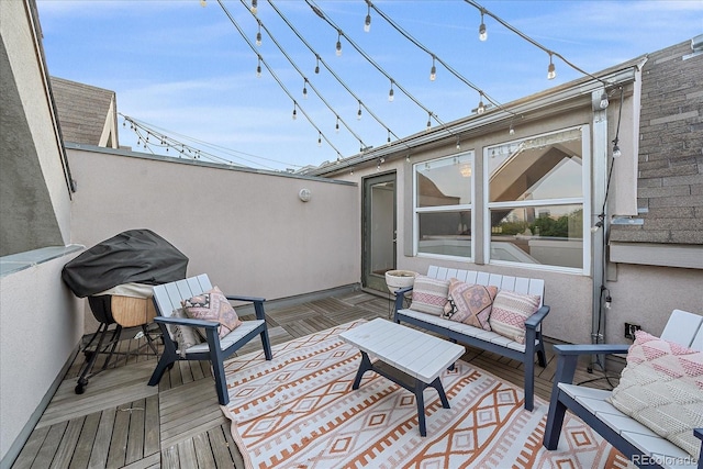 wooden terrace featuring an outdoor hangout area