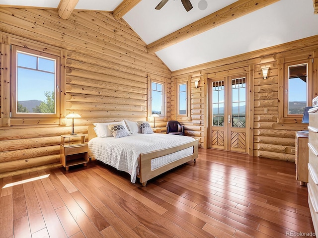 bedroom with hardwood / wood-style flooring, rustic walls, access to exterior, high vaulted ceiling, and beamed ceiling