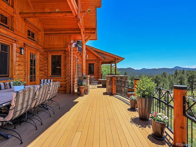 wooden deck featuring a mountain view