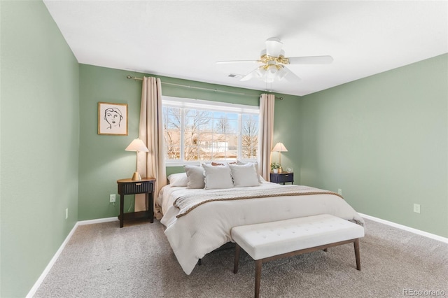 carpeted bedroom with ceiling fan, visible vents, and baseboards