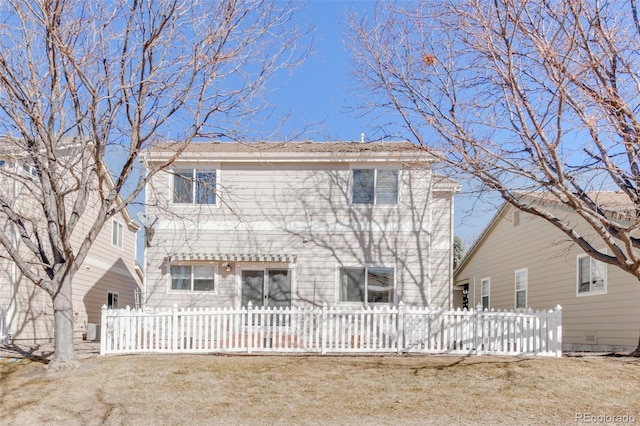 back of property with a fenced front yard