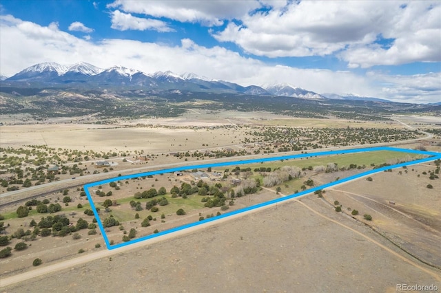 birds eye view of property with a mountain view