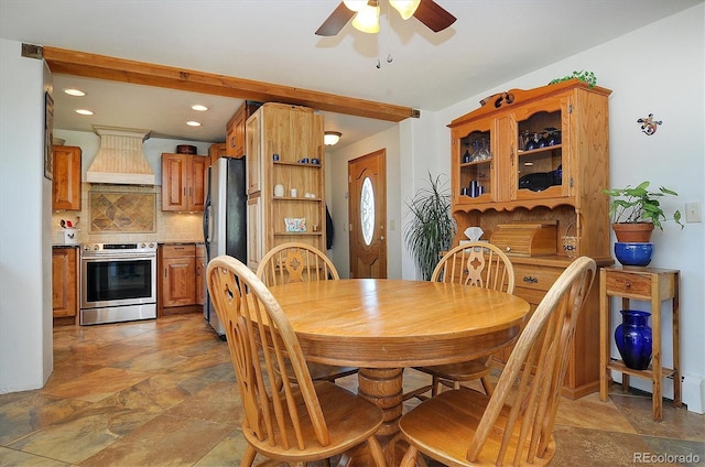 dining room with ceiling fan and light tile floors